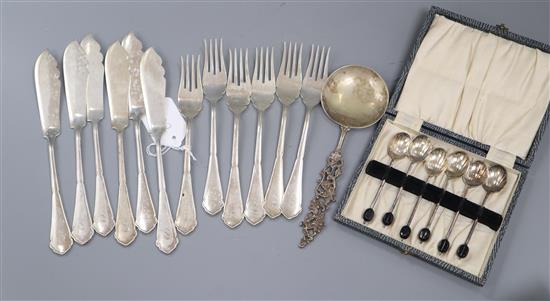 A set of six pairs German 800 fish eaters, a cased set of silver coffee spoon and a continental 835 spoon.